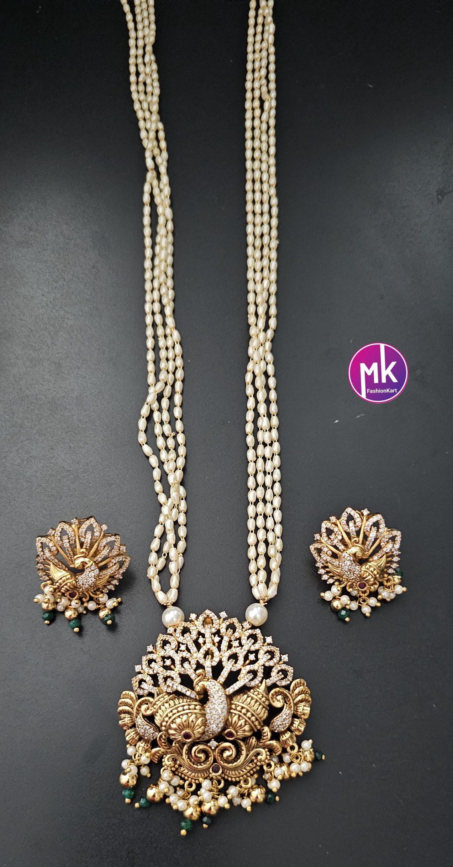 Peacock Matte gold finish CZ/AD stone long Mala with rice pearls and matching beautiful Earrings - Peacock mala - MK Fashionkart