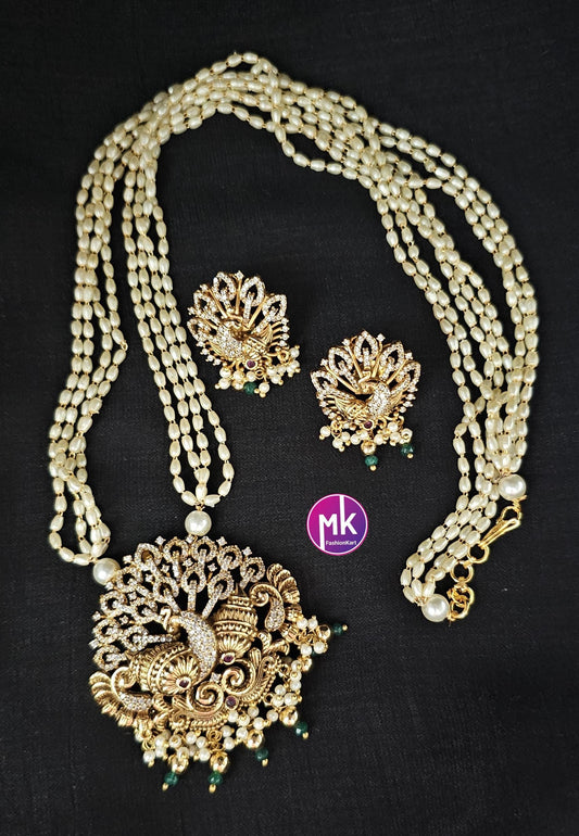 Peacock Matte gold finish CZ/AD stone long Mala with rice pearls and matching beautiful Earrings - Peacock mala - MK Fashionkart