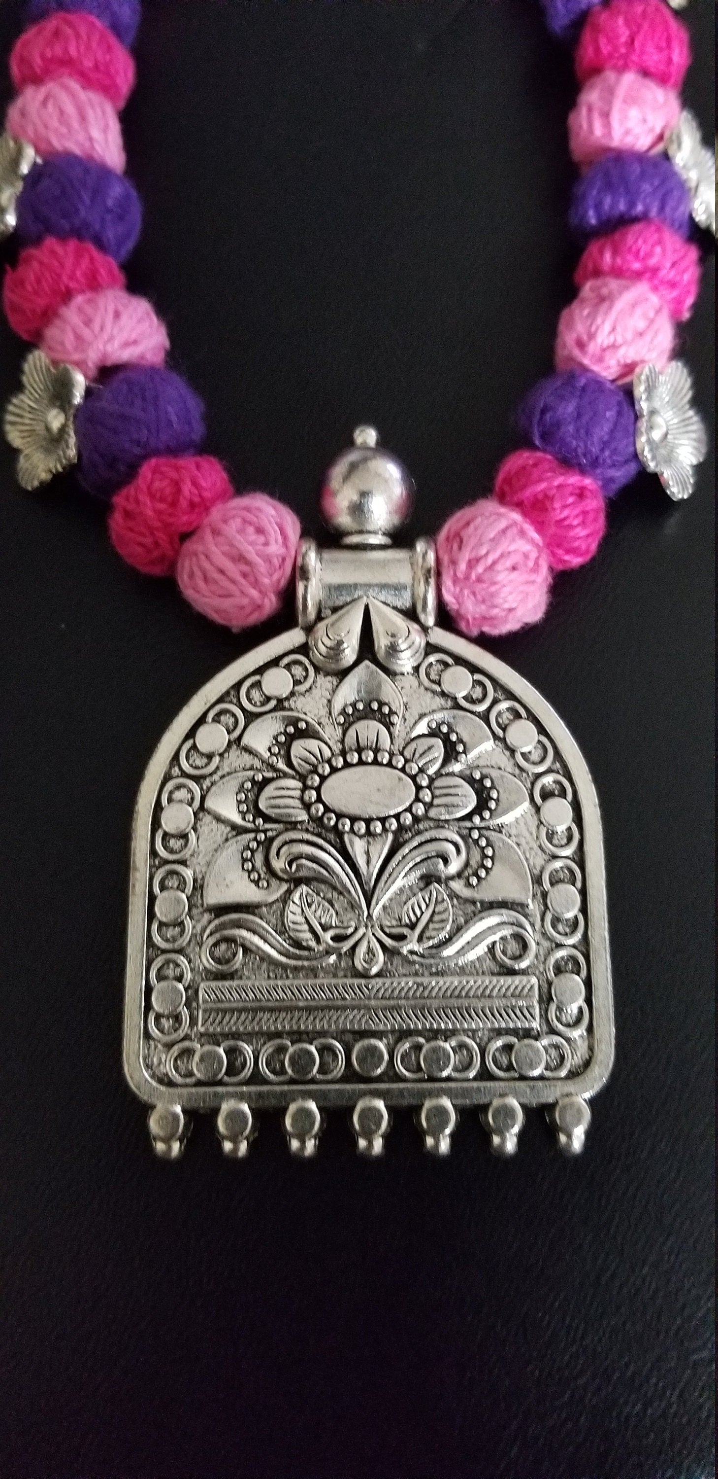 German silver pendant with multi color thread beads