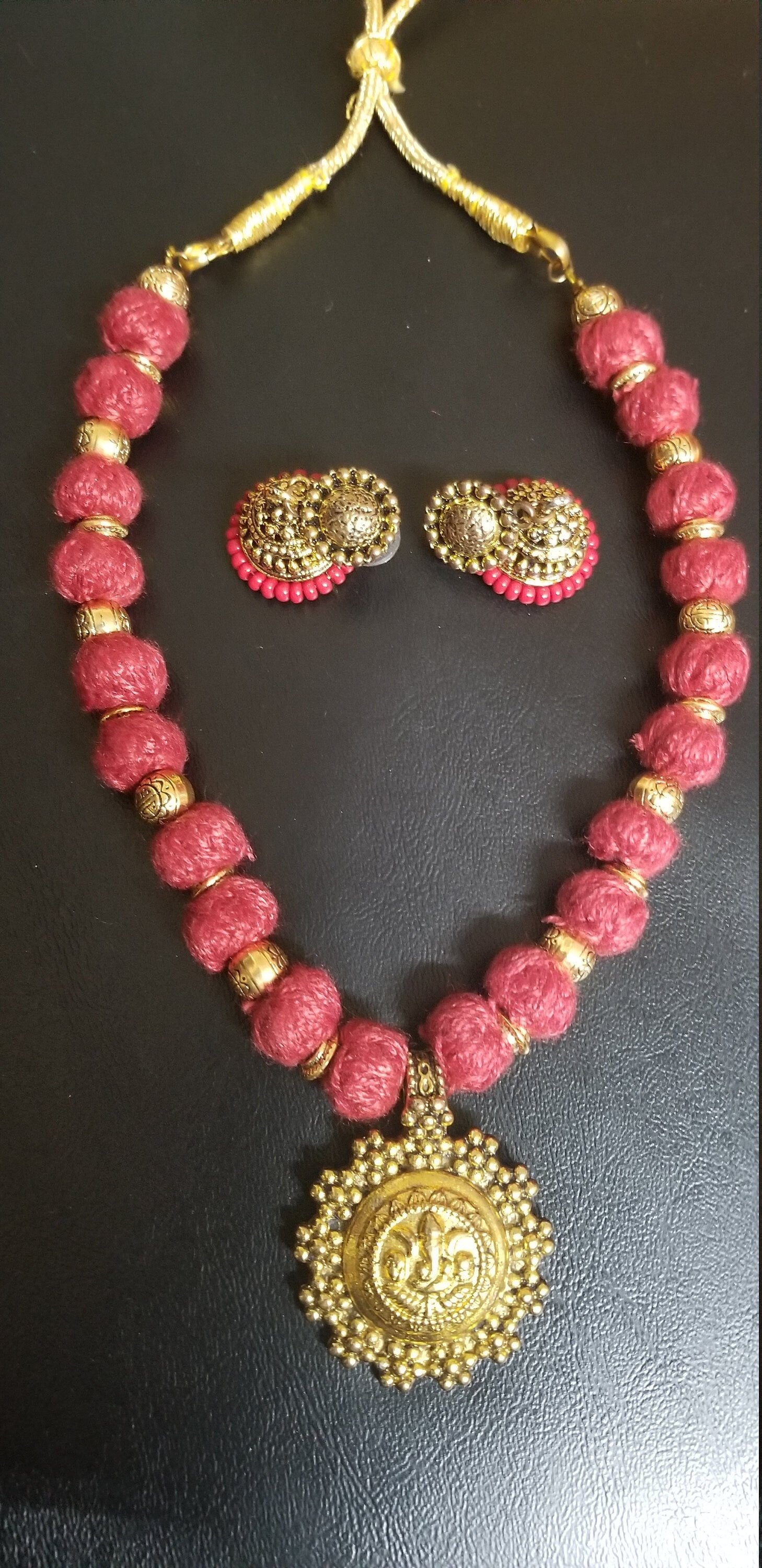 Antique pendent with maroon thread bead chain with matching antique jhumkis