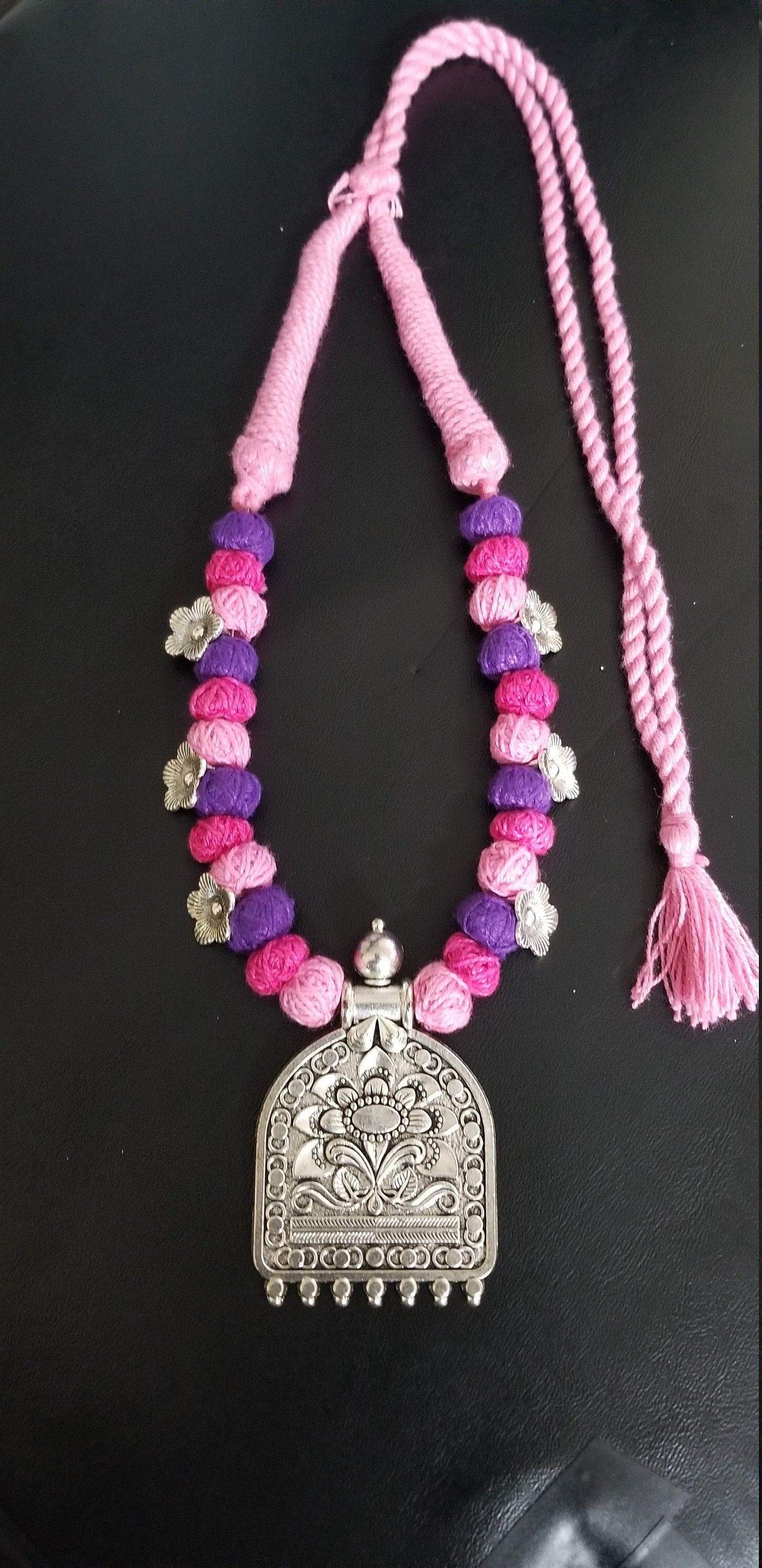 German silver pendant with multi color thread beads