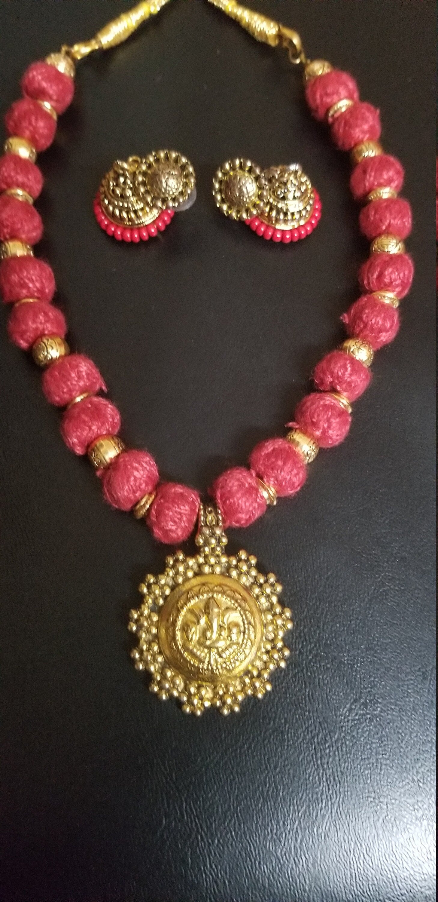 Antique pendent with maroon thread bead chain with matching antique jhumkis