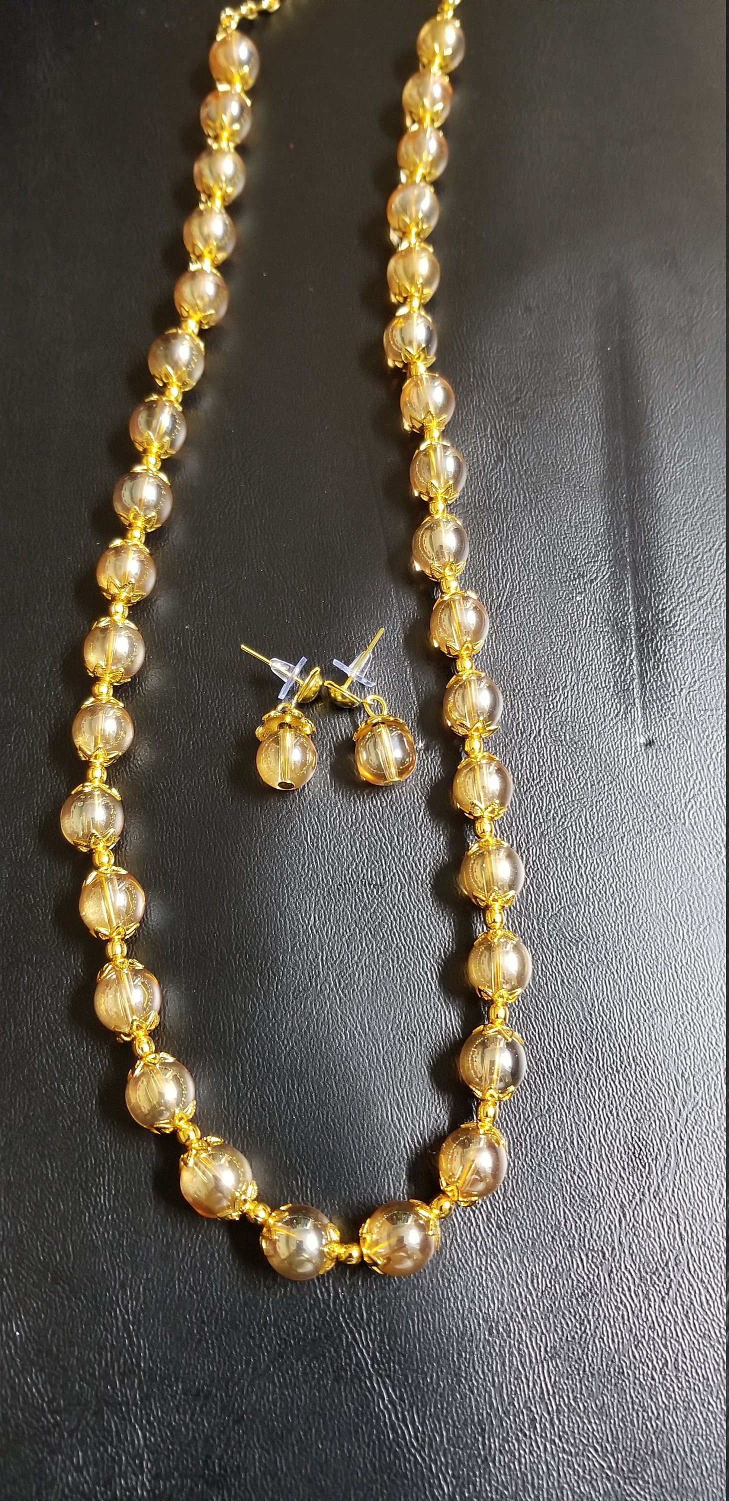 Golden bead chain with matching earrings