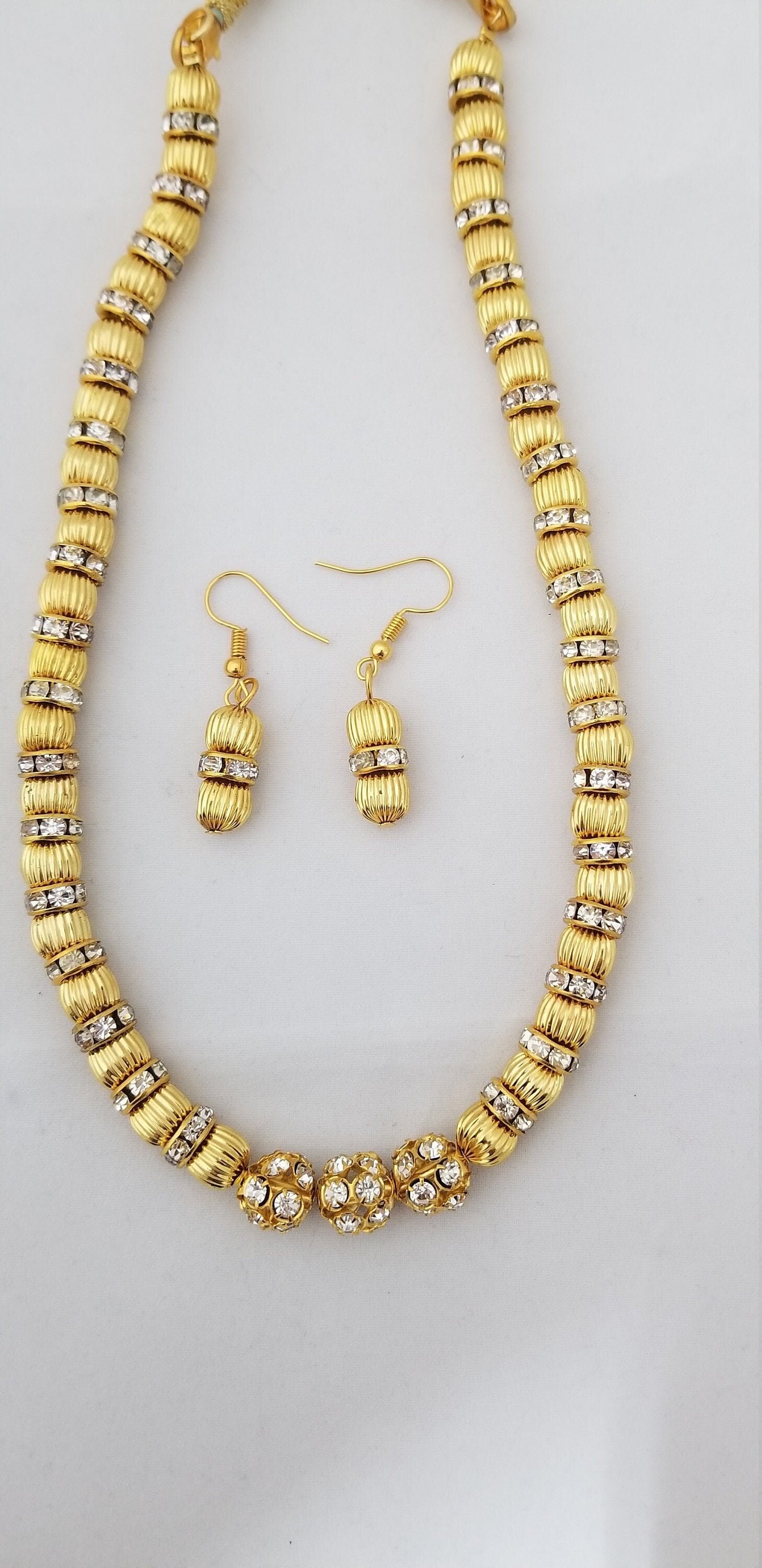 Gold bead with Rhinestone with matching Earrings