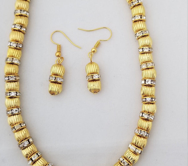 Gold bead with Rhinestone with matching Earrings