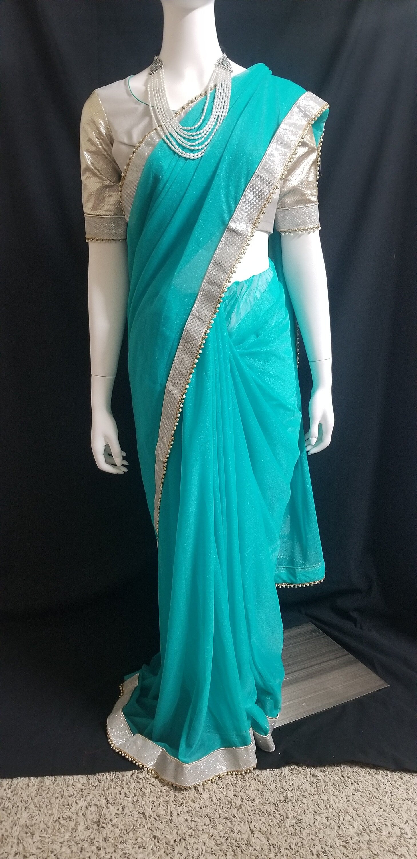 Designer Teel green Color Saree with silver jari border and stitched Silver color Blouse - Blouse 38" (Upto 42)