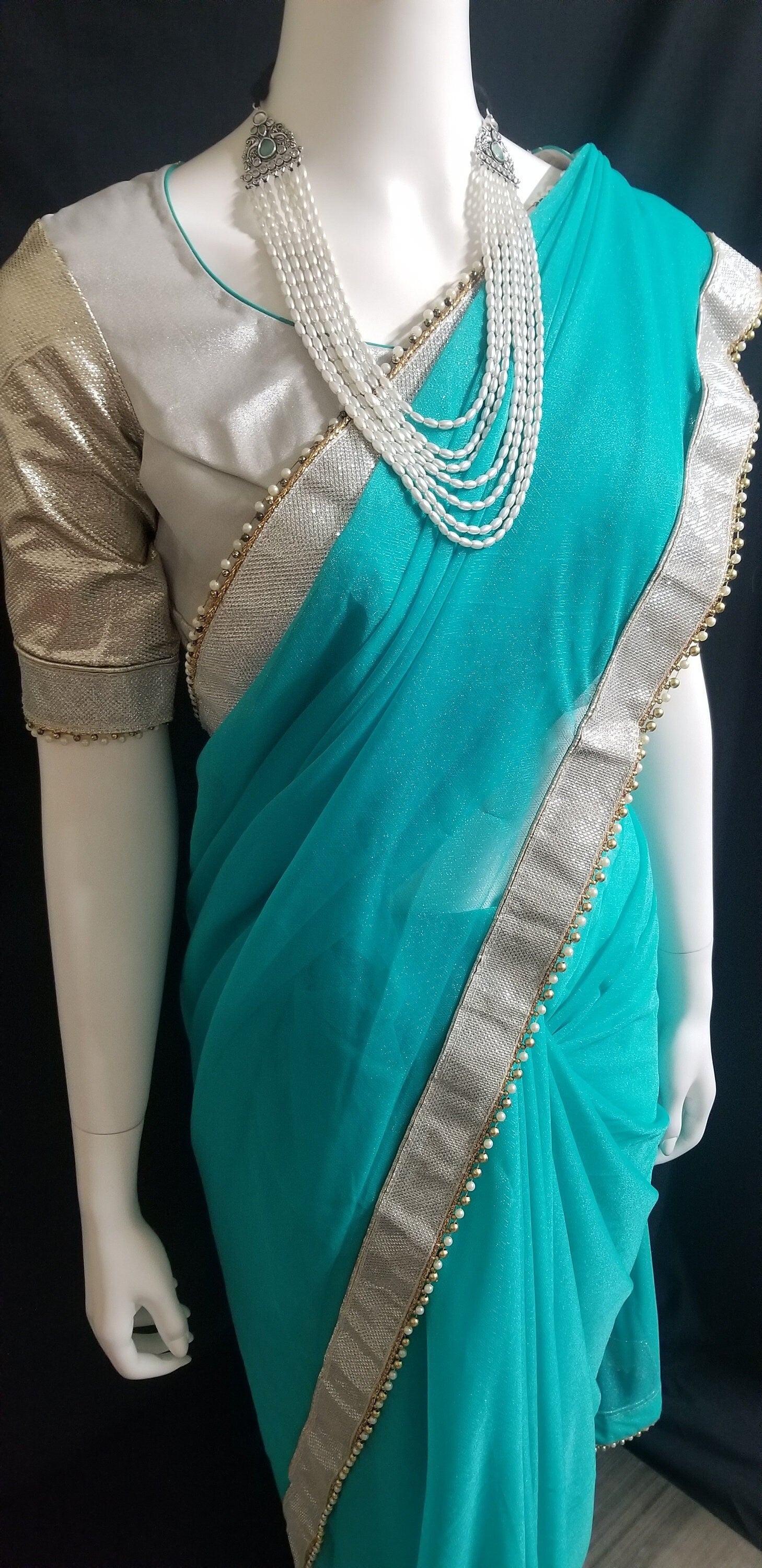 Designer Teel green Color Saree with silver jari border and stitched Silver color Blouse - Blouse 38" (Upto 42)