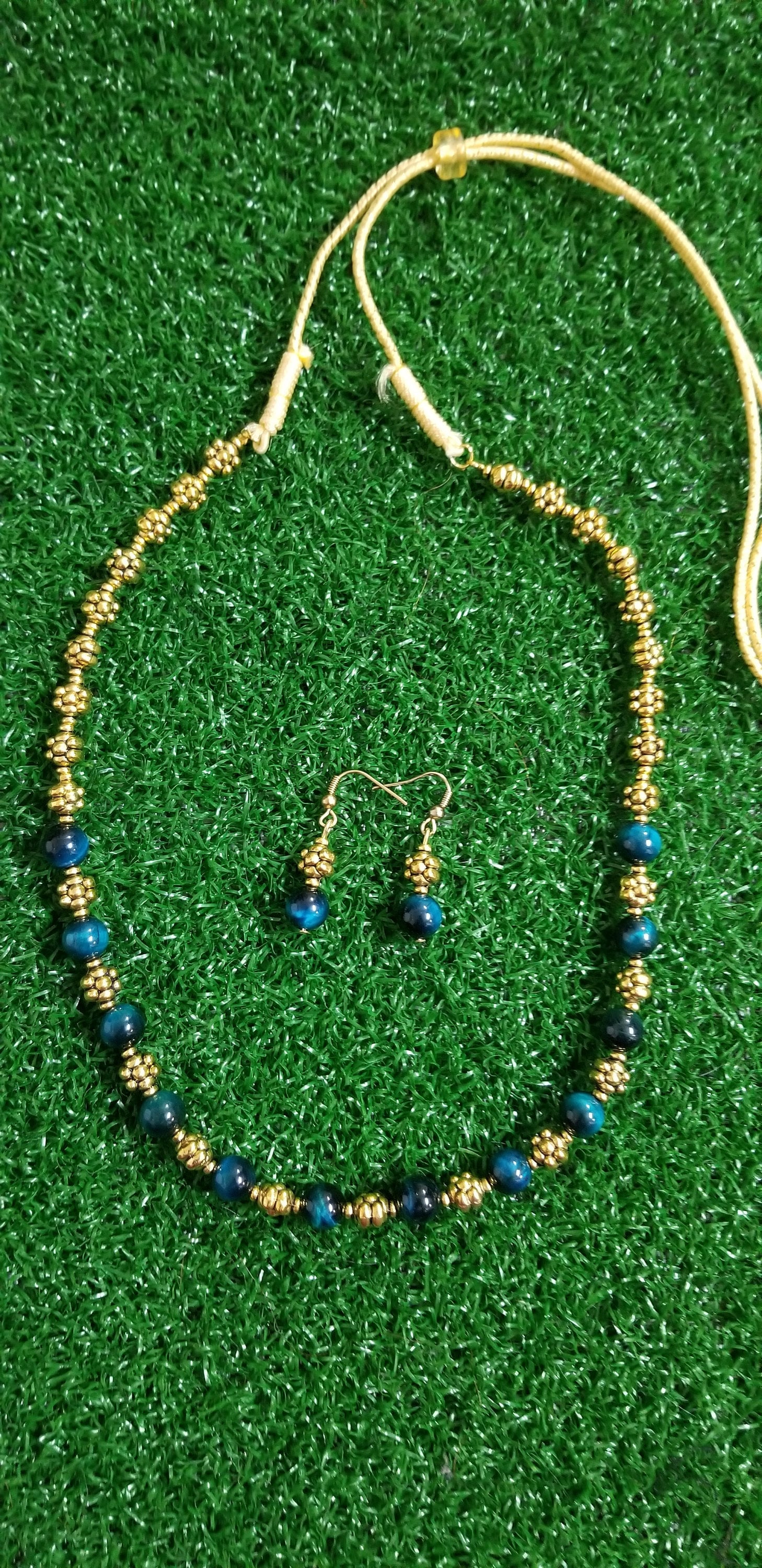 Antique bead with greenish bead chain and Earrings