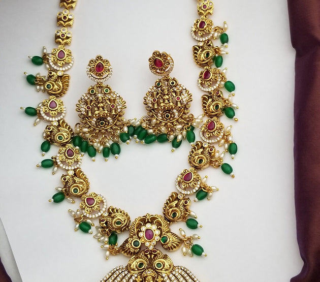 Lakshmi Peacock Premium quality Gold Jewelry Replica Haram with Precious green bead hangings with matching Earrings