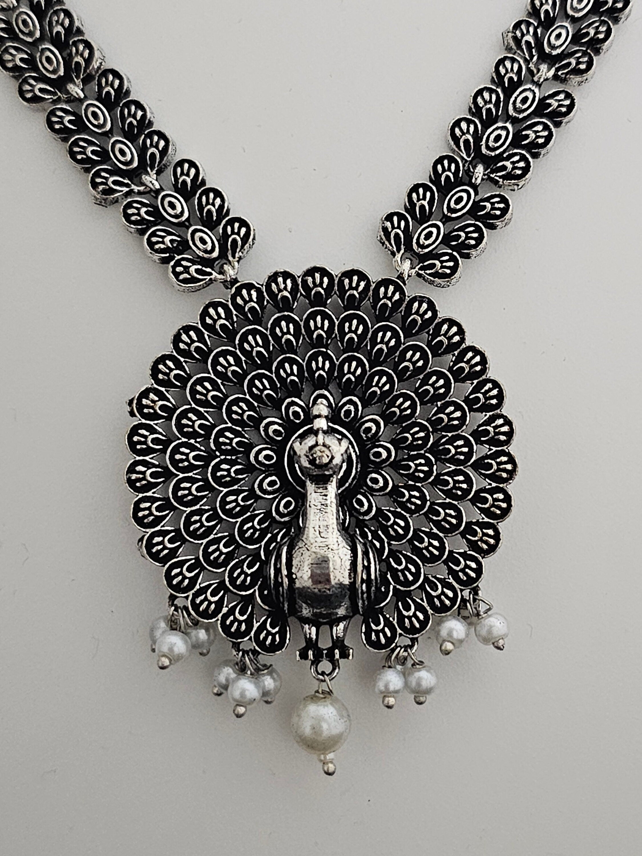 Peacock Oxidized Silver Middle Haram with matching Earrings