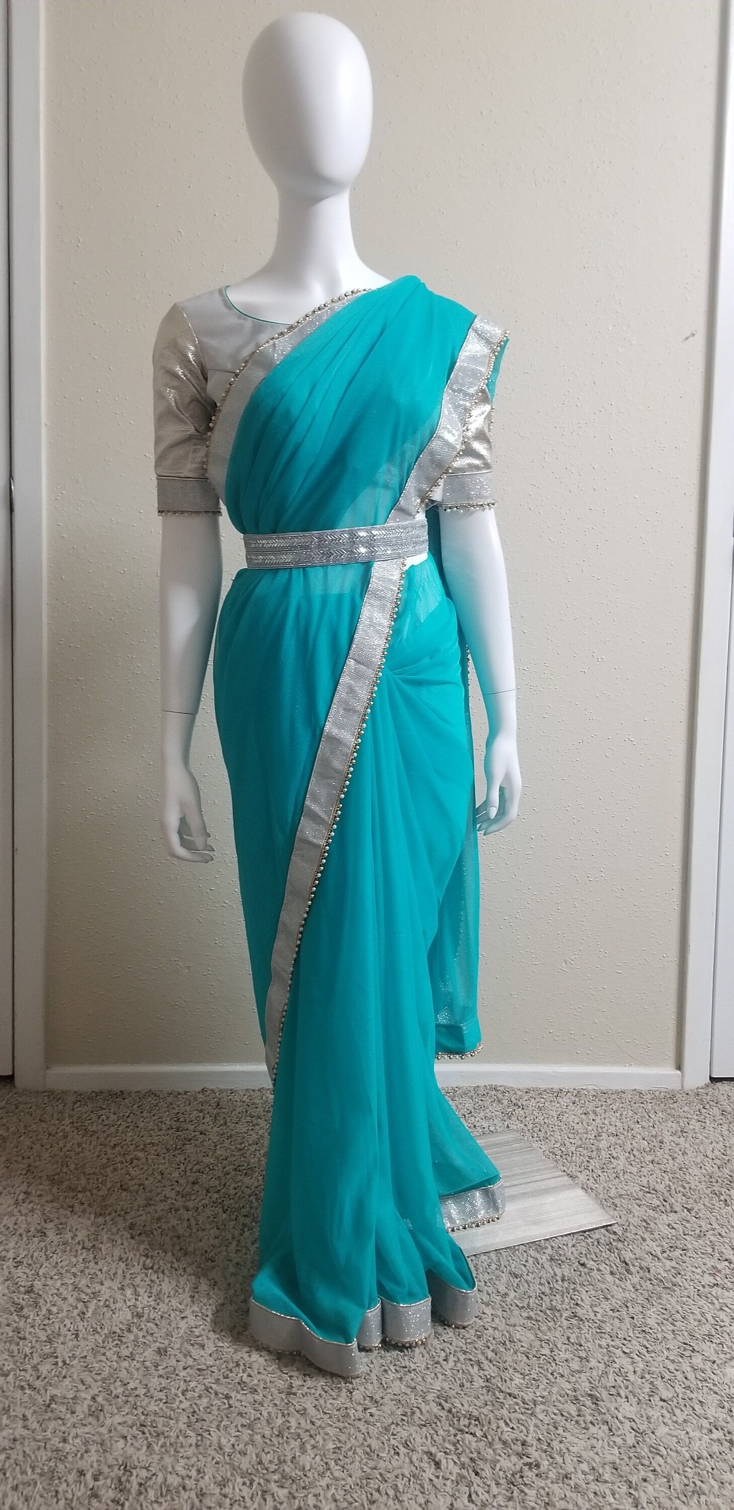 Designer Teel green Color Saree with silver jari border and stitched Silver color Blouse - Blouse 38" (Upto 42)