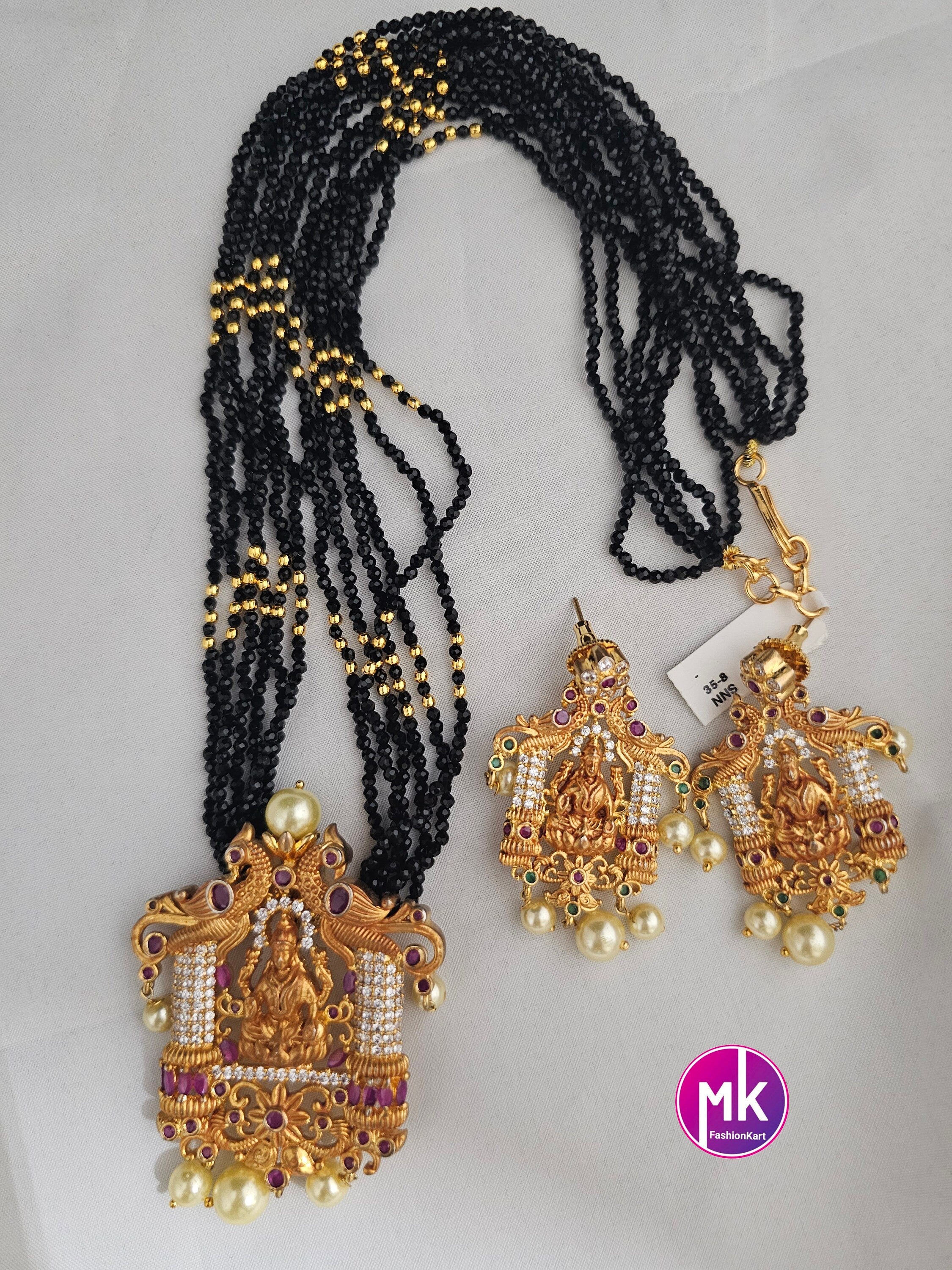 Lakshmi Peacock design AD Pendent with multi-layer crystal Mala and Matching AD stone Earrings