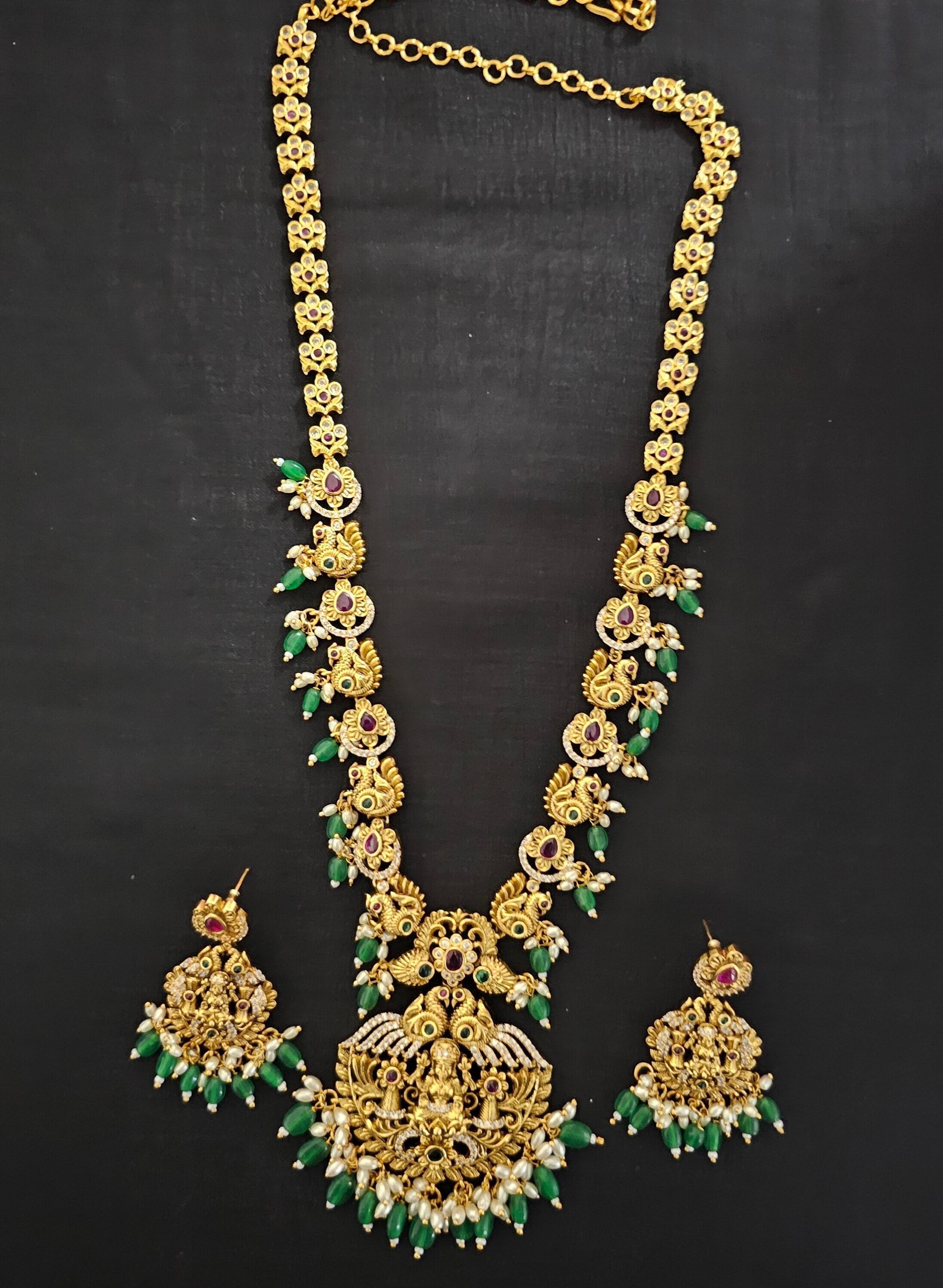 Lakshmi Peacock Premium quality Gold Jewelry Replica Haram with Precious green bead hangings with matching Earrings
